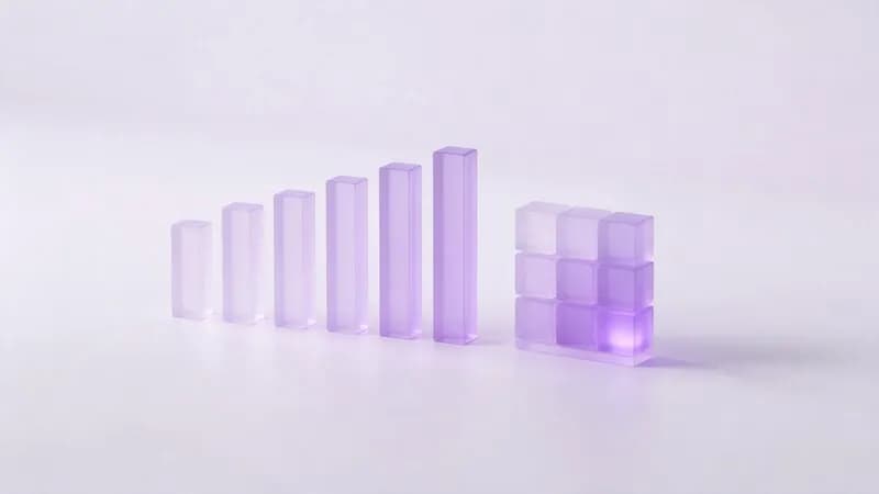 Glass bar chart columns beside a grid of glass cubes shaded like a heat map